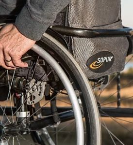 man on chair wheel 
